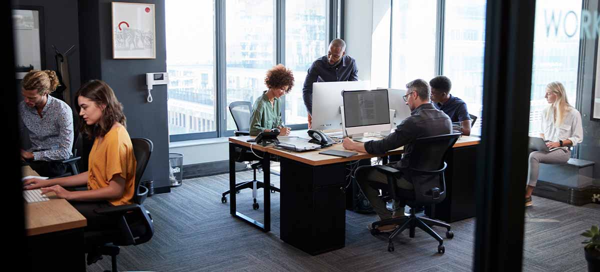 Office environment, people and desks.